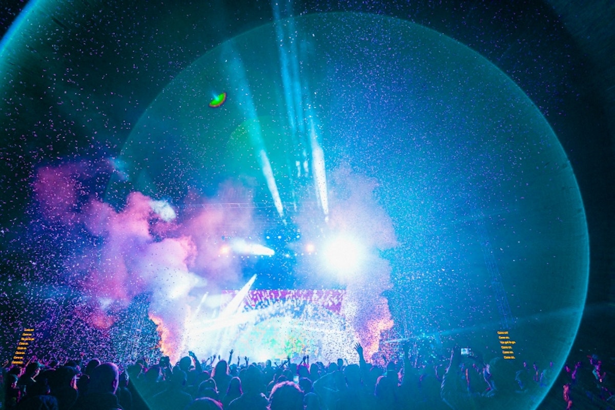 Flaming Lips live, colorful photo of crowd and stage with lens blur