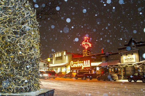 Cowbar bar in the snow at night