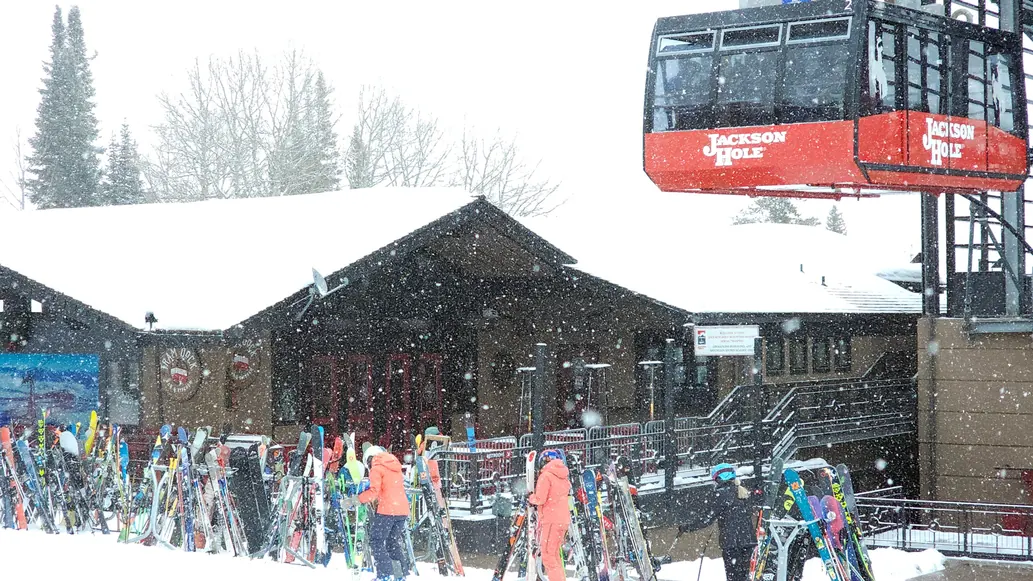 Tram dock bar with tram in front of it on snowy day