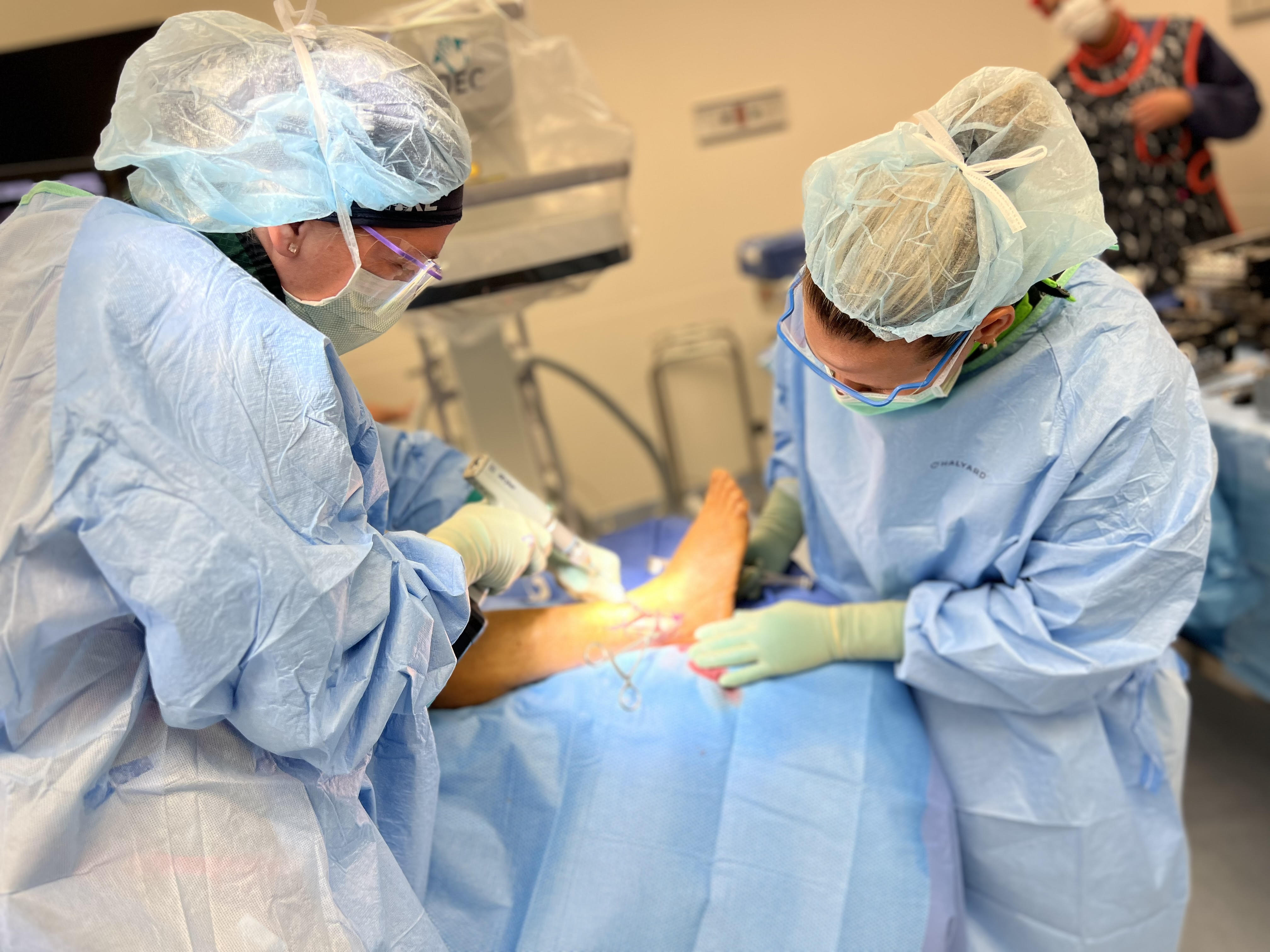 doctors perfoming surgery at Foot and Ankle Speciality Group Inc. 
