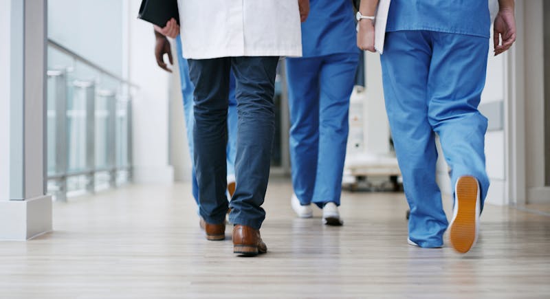 Healthcare professionals walking