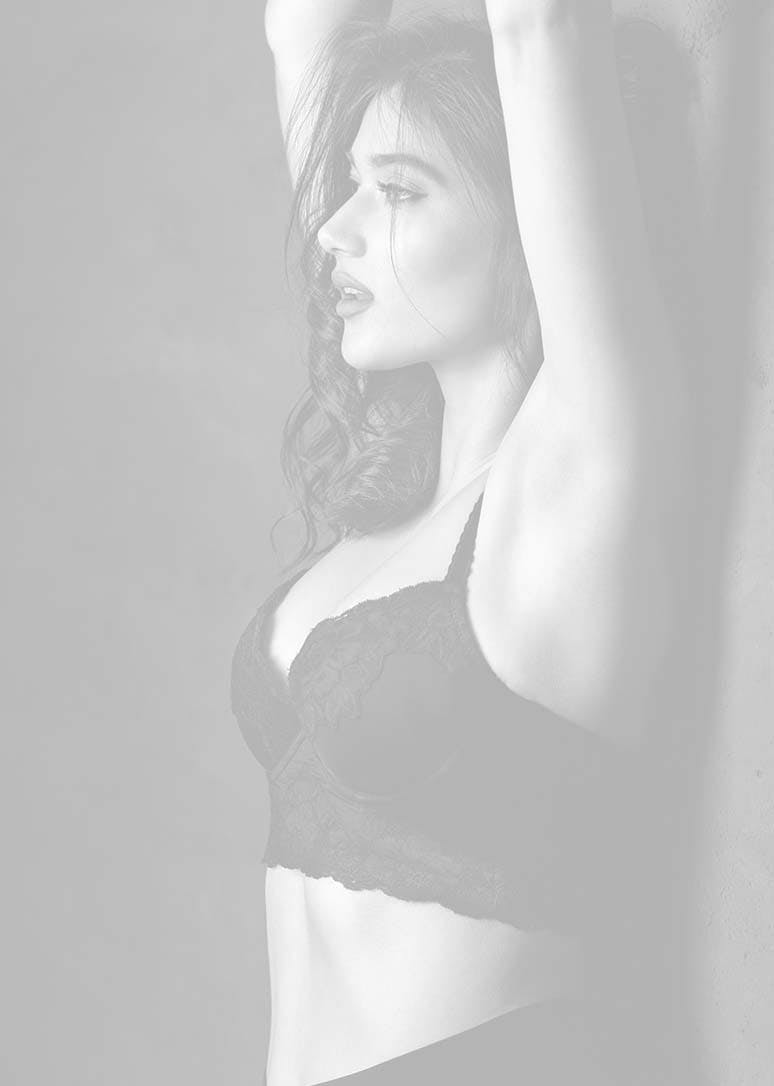 attractive woman against wall