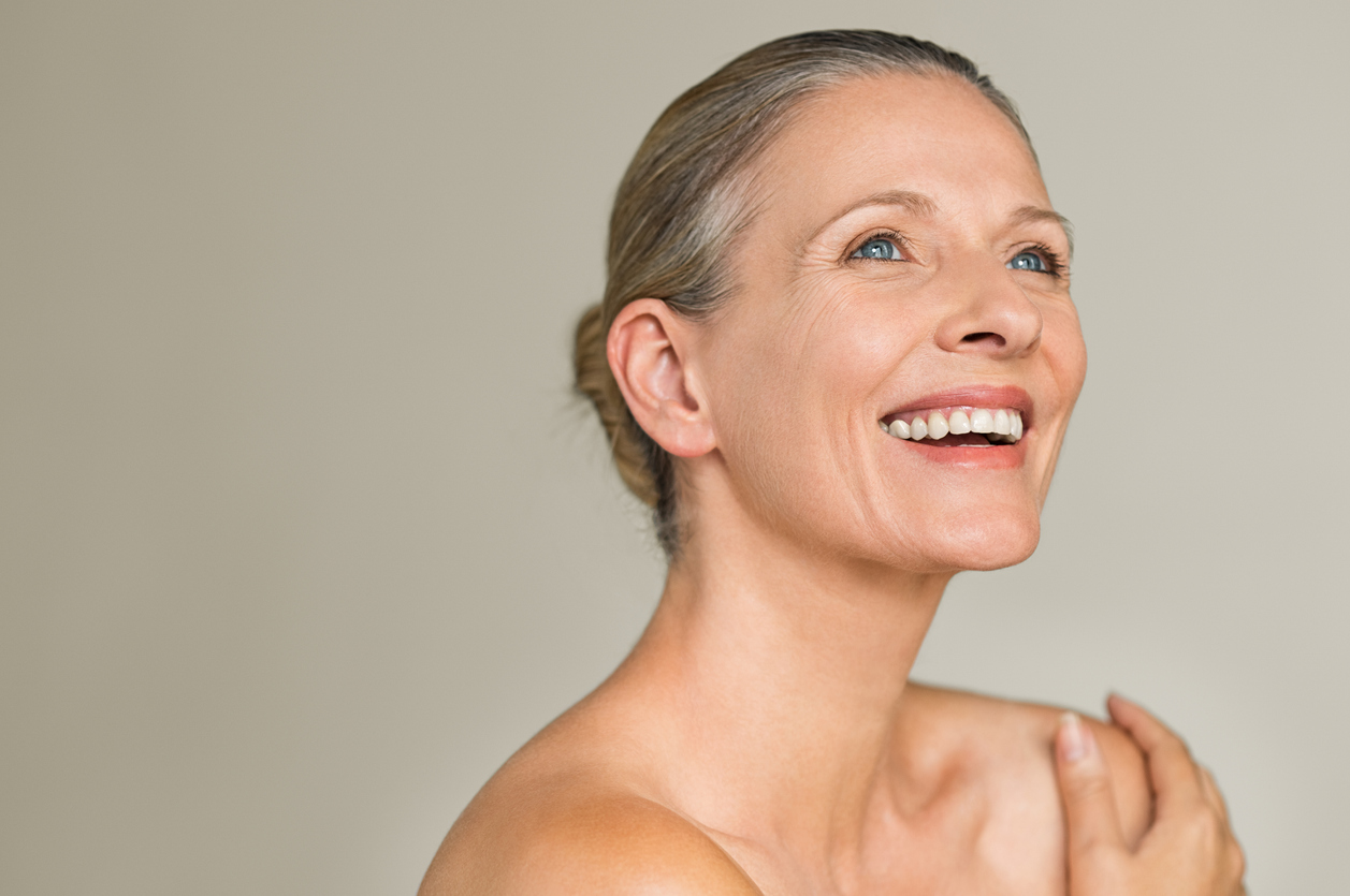 Older woman turned to the side smiling