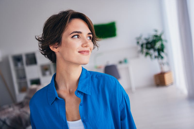 woman in blue shirt side profile