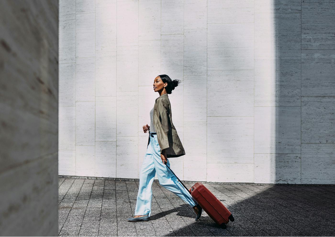 Woman walking with a suitcase