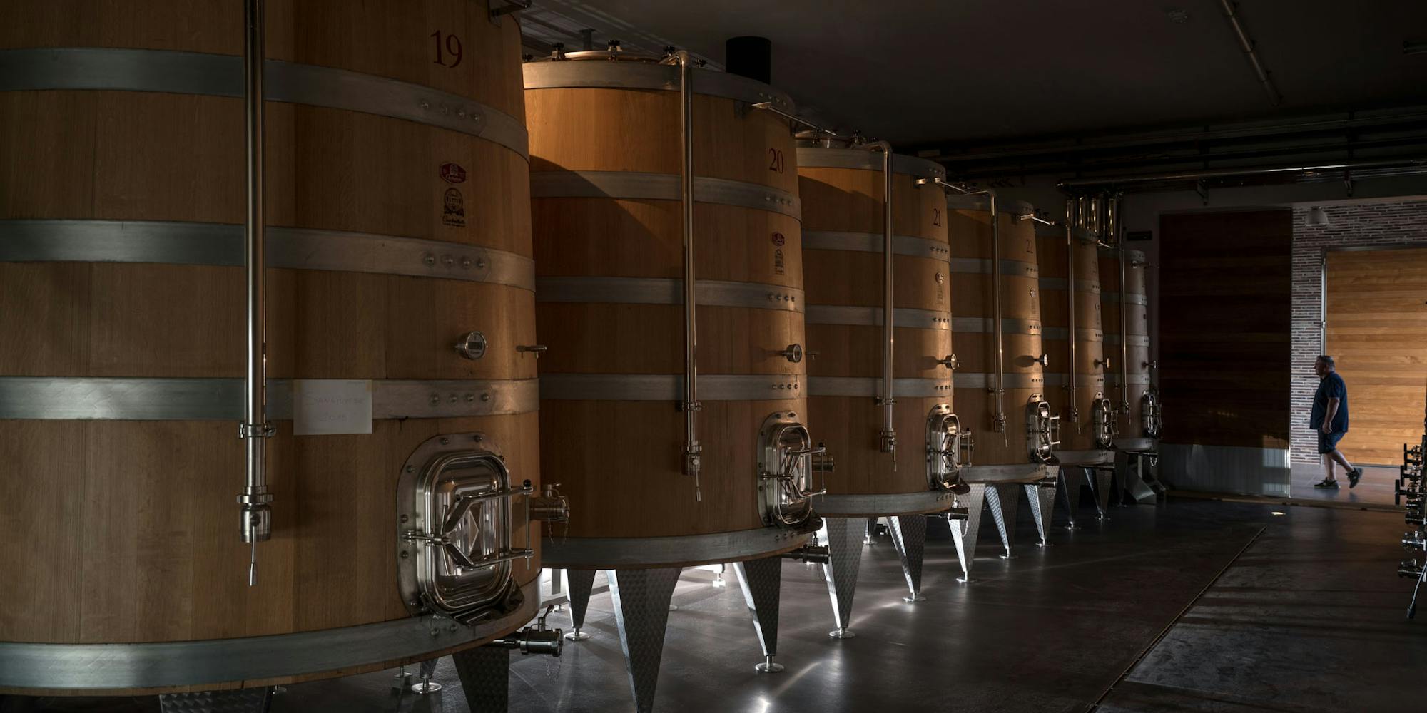 Winery large conical wooden casks View on large conical wooden casks in the winery of Fabbrica Pienza