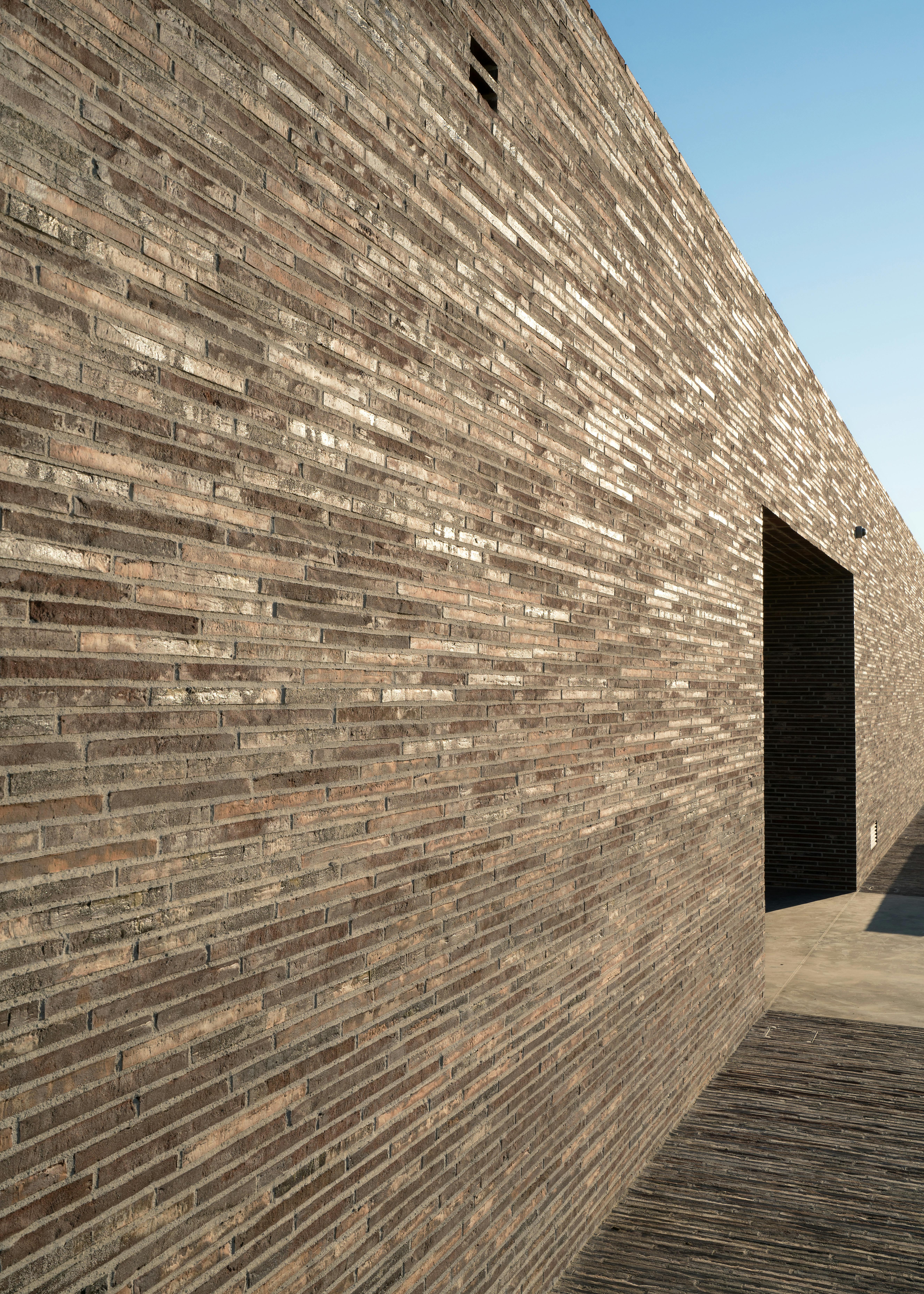 Shining brick wall with sun reflects on Fabbrica winery
