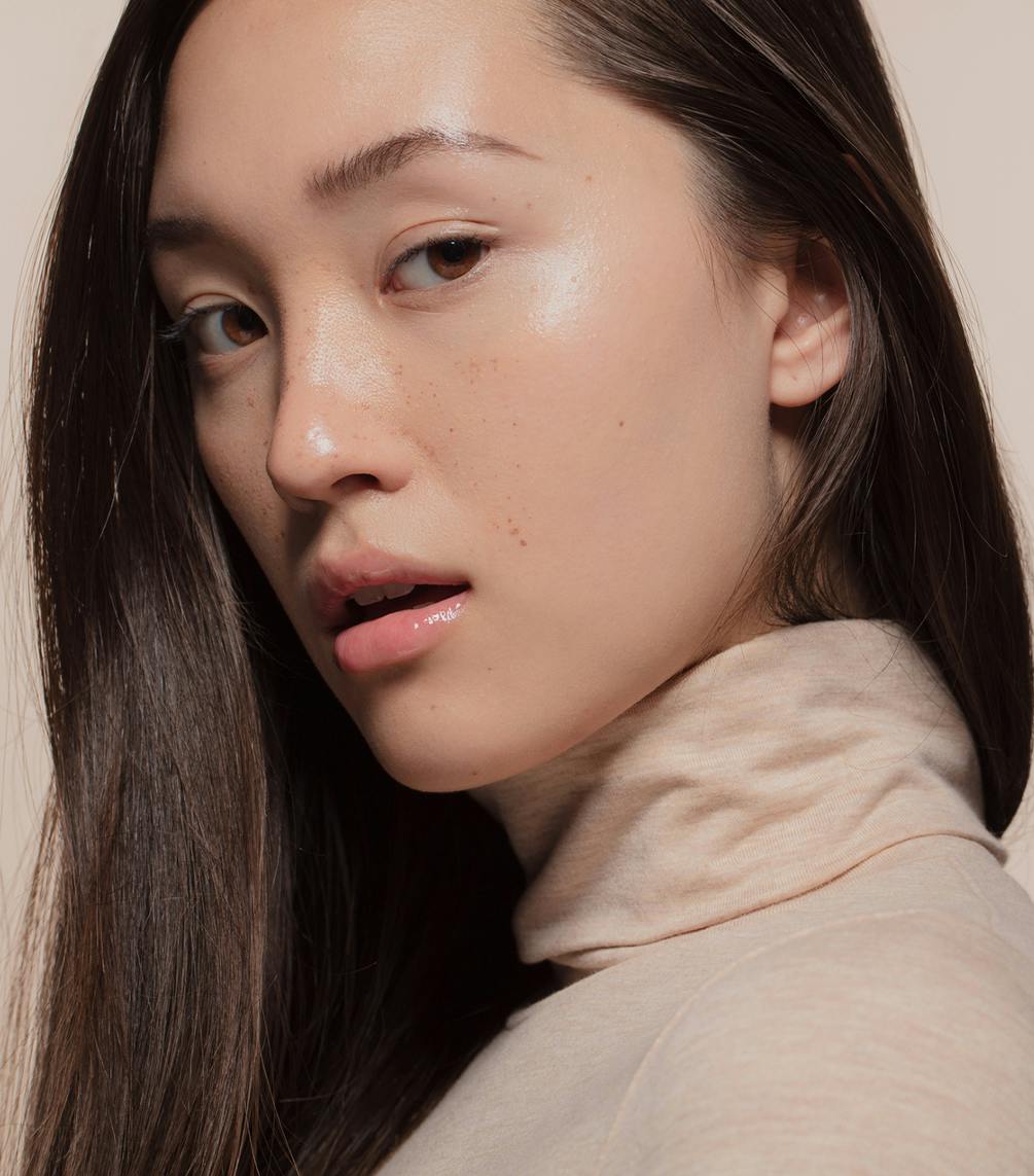 young asian woman with clear skin
