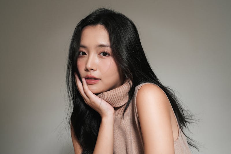 model in brown turtleneck sweater