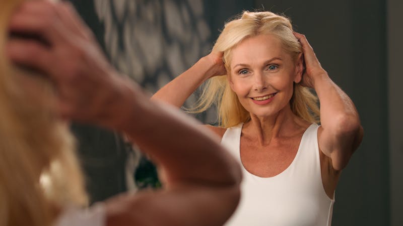 Woman looking in the mirror