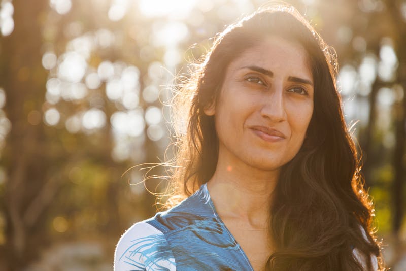 woman in blue top in the sunlight