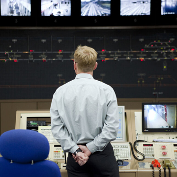 Urban transport control room with man in the center