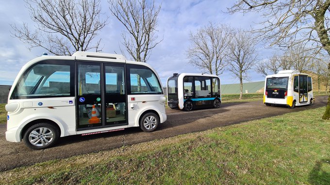3 autonomous vehicles on a road at SEMA