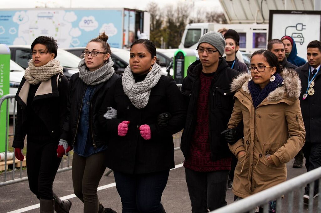 Poets (L-R): Eunice Andrada, Isabella Borgeson, Terisa Siagatonu, John Meta Sarmiento, and Kathy Jetn̄il-Kijiner march to the UN Climate Talks in Paris, 2015; photo: Global Call for Climate Action
