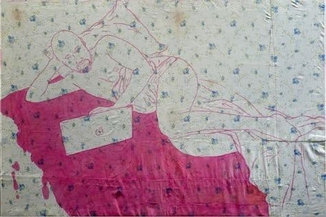 Pink drawing of a man laying in bed looking at a laptop. Drawing in on white fabric with blue detailing.