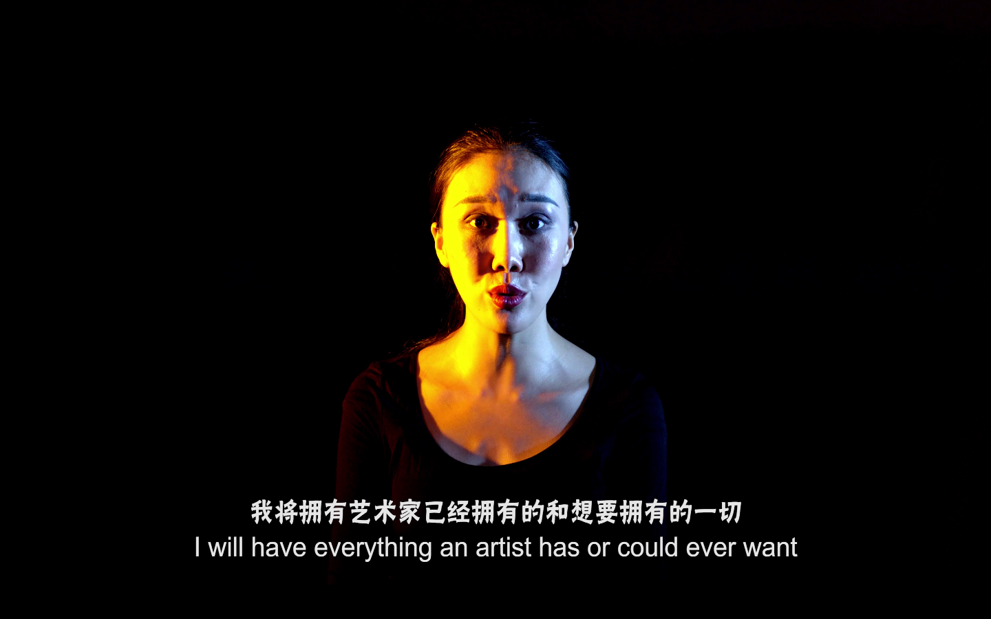 An image of a woman against a black background. The text reads 'I will have everything an artist has or could ever want'.