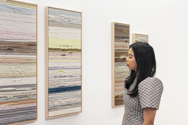 Crossing Threads®; Holding Patterns: Crossing Threads®; Installation view, 4A Centre for Contemporary Asian Art, August 2020, Kass Hernandez of Crossing Threads® with the following works: (Left) Crossing Threads®, Seek, 2020, bamboo, cotton, hand dyed Merino wool, hemp, Japanese silk and paper, linen, mixed natural fibres and sari silk framed in Tasmanian oa. Handwoven by Lauren Hernandez. (Right) Crossing Threads®, Consolation, 2020, bamboo, cotton, hand dyed Merino wool, handspun upcycled yarn, hemp, leather, linen and mixed natural fibres framed in Tasmanian oak. Handwoven by Kass Hernandez.