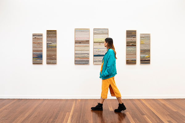 Image: Crossing Threads®; Holding Patterns: Crossing Threads®; Installation view, 4A Centre for Contemporary Asian Art, August 2020. From Left: Crossing Threads®, Seek, 2020, bamboo, cotton, hand dyed Merino wool, hemp, Japanese silk and paper, linen, mixed natural fibres and sari silk framed in Tasmanian oa. Handwoven by Lauren Hernandez. Centre: Crossing Threads®, Consolation, 2020, bamboo, cotton, hand dyed Merino wool, handspun upcycled yarn, hemp, leather, linen and mixed natural fibres framed in Tasmanian oak. Handwoven by Kass Hernandez. Right: Crossing Threads®, Inward State, 2020, bamboo, cotton, hand dyed Merino wool, hemp, Japanese silk and paper, linen, mixed natural fibres and sari silk framed in Tasmanian oak. Handwoven by Lauren Hernandez, courtesy the artists. 