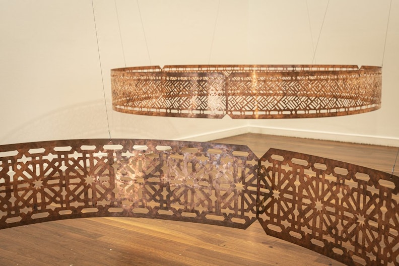 Shireen Taweel, ‘tracing transcendence’ (detail), 2018, pierced copper, band 1: 30 x 180 x 180cm; band 2: 30 x 210 x 210cm; photo: Kai Wasikowski for 4A Centre for Contemporary Asian Art, courtesy the artist.