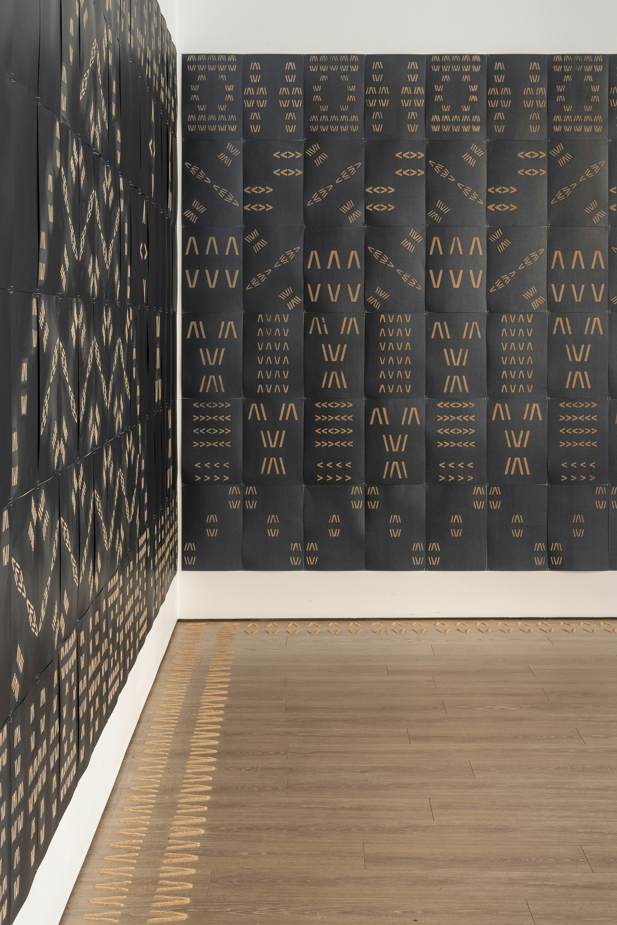 Vaimaila Urale, Manamea ma Anivanuanua, 2020, black card and sand, 240 pieces across two walls, each wall installation measuring 5940x2520mm. Photo: Kai Wasikowski for 4A Centre for Contemporary Asian Art. Courtesy the artist.