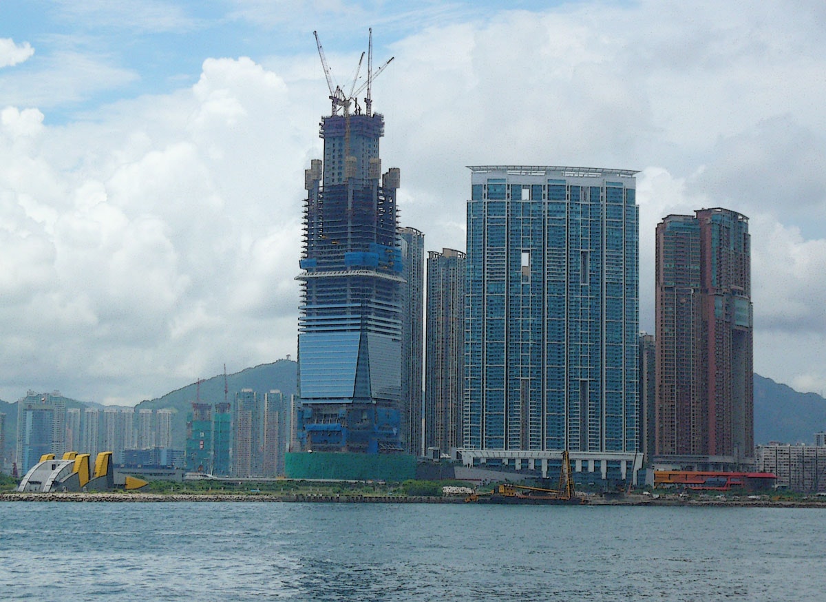 A skyscraper being constructed by the harbour in Hong Kong.