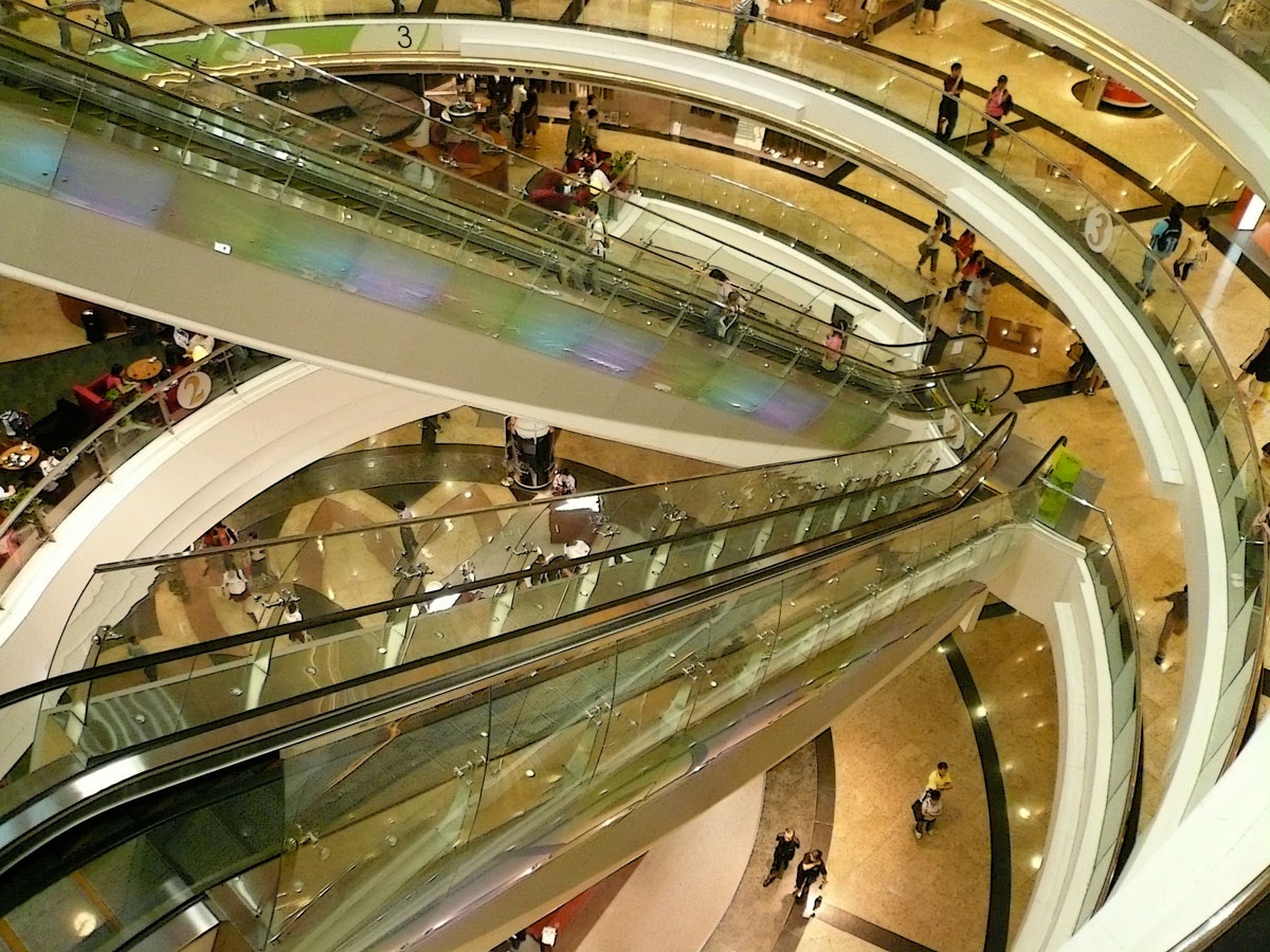 Aerial view of escalators in a shopping centre.