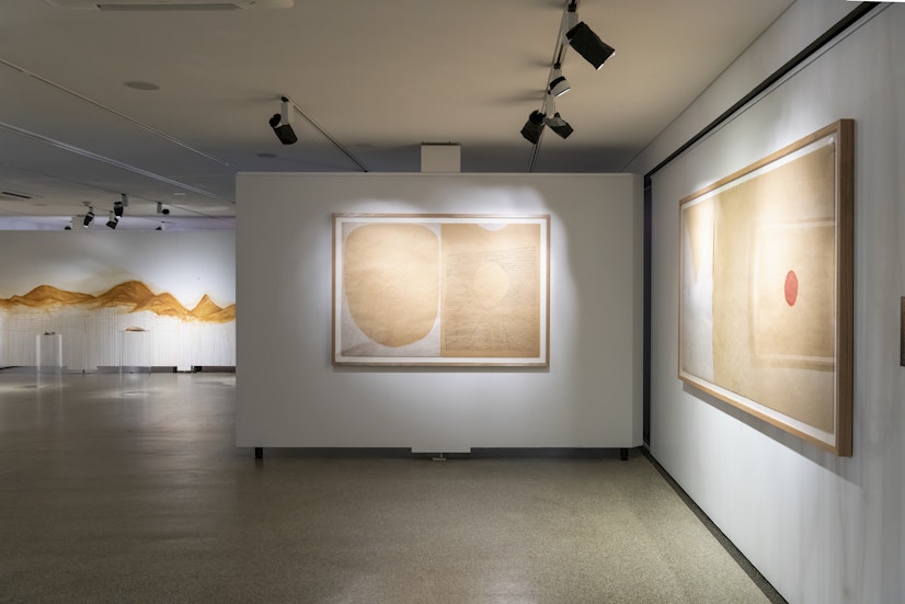 Left: Dean Cross, Full Moon Dreaming, 2016, Ngunnawal Ochre and fibre-based pen on craft paper, diptych, 152 x 102cm; both works courtesy the artist and Yavuz Gallery. Right: Dean Cross, Nothing Changes (apart/hide), 2016, Ngunnawal Ochre and fibre-based pen on craft paper, triptych, 228 x 102cml photo: Rhiannon Hopley for Drawn by stones, presented by 4A Centre for Contemporary Asian Art at Gallery Lane Cove + Creative Studios, 2022