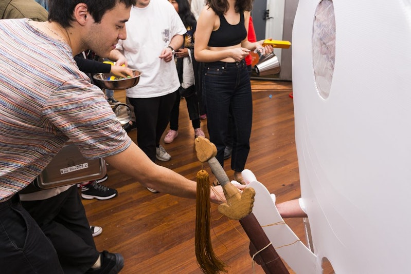 A photo inside 4A showing a group of people participating in the Hungry Ghost Festival: The Burrangong Affray event