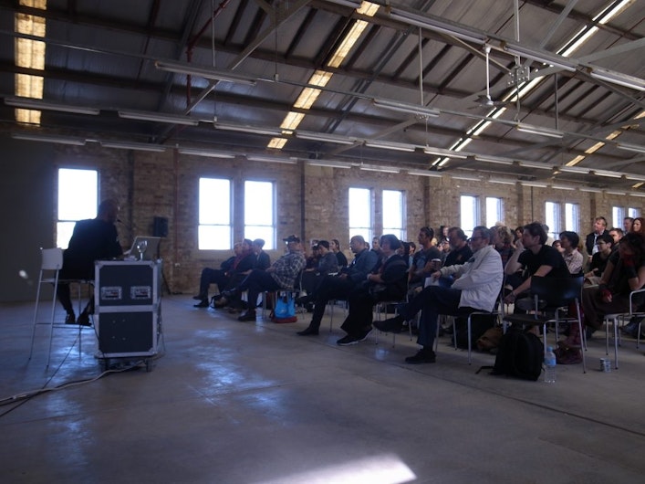 Photo of an audience listening to a lecture by Sumugan Sivanesan