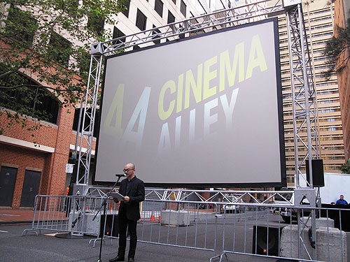 A speaker addressing the audience during 4A Cinema Alley