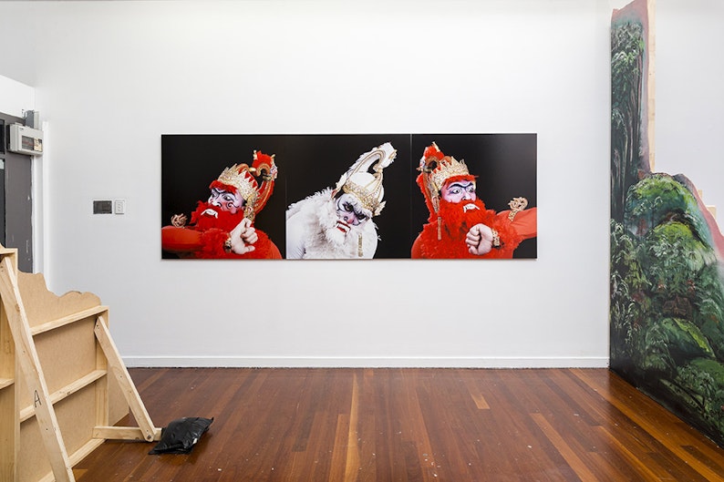Centre Wall: Adri Valery Wens, The Wanara (Subali/Hanoman/Sugriwa) (2016), pigment on silver rag paper triptych, installation view, 4A Centre for Contemporary Art. Courtesy the artist  Left and right: Shaun Gladwell, Monkey Magic Manifestations (2016), mixed medium (wood, canvas, acrylic), installation view, 4A Centre for Contemporary Art. Courtesy the artist