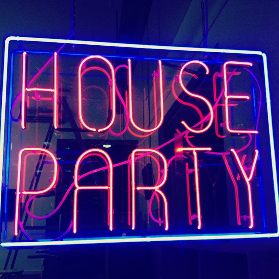 A neon sign with pink text reading house party and a blue border