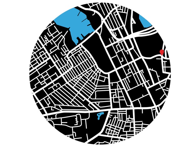 A circular black and white map showing the location of Verticle Villages