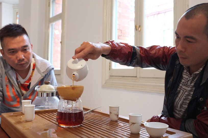 Yangjiang Group, 喝茶办公 Tea Office (2015), iteration of a tea drinking performance at 4A Centre for Contemporary Art. Courtesy the artists and Vitamin Creative Space, Guangzhou.