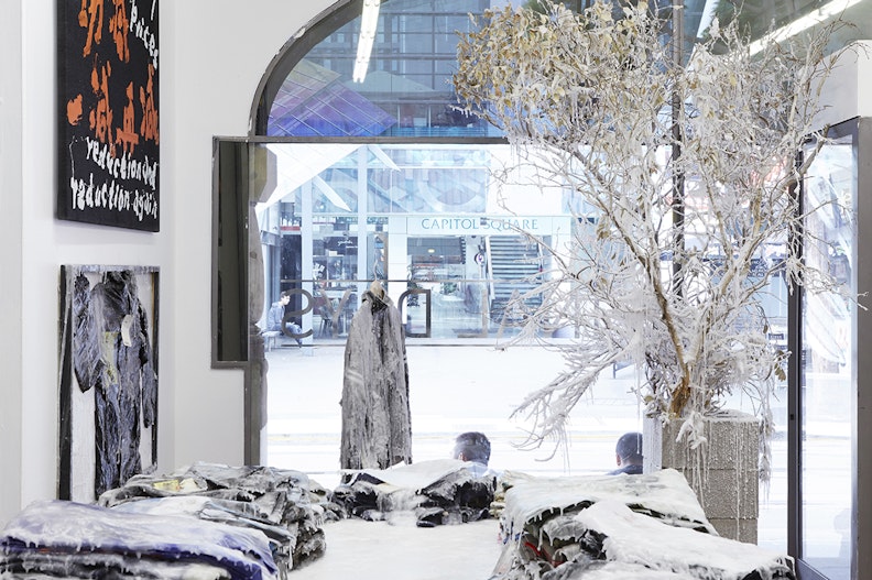 Yangjiang Group, 最后一日 Final Days (2015), mixed media installation (acrylic, clothing, clothing racks, paraffin wax), dimensions variable. Installation view, 4A Centre for Contemporary Asian Art. Commissioned by 4A Centre for Contemporary Asian Art, courtesy the artists and Vitamin Creative Space, Guangzhou. Photo: Zan Wimberley.