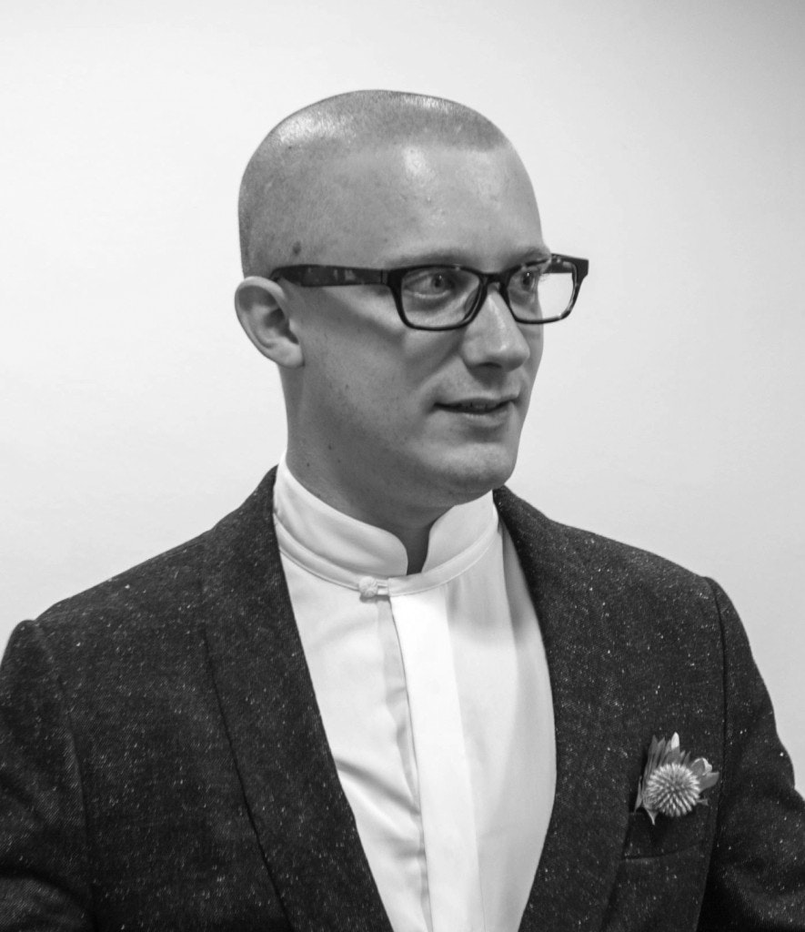 A black and white headshot photo of Robin Peckham