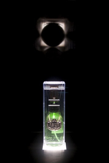 Abdullah M.I. Syed, The Fragrance of the Moon (2013), Brut for Men bottle, Perspex and transparency projector; detail, 4A Centre for Contemporary Asian Art. Courtesy the artist. Image: Document Photography.