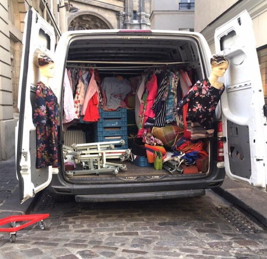 A photo taken in France by Garry Trinh of a car boot with mannequins and clothes inside.