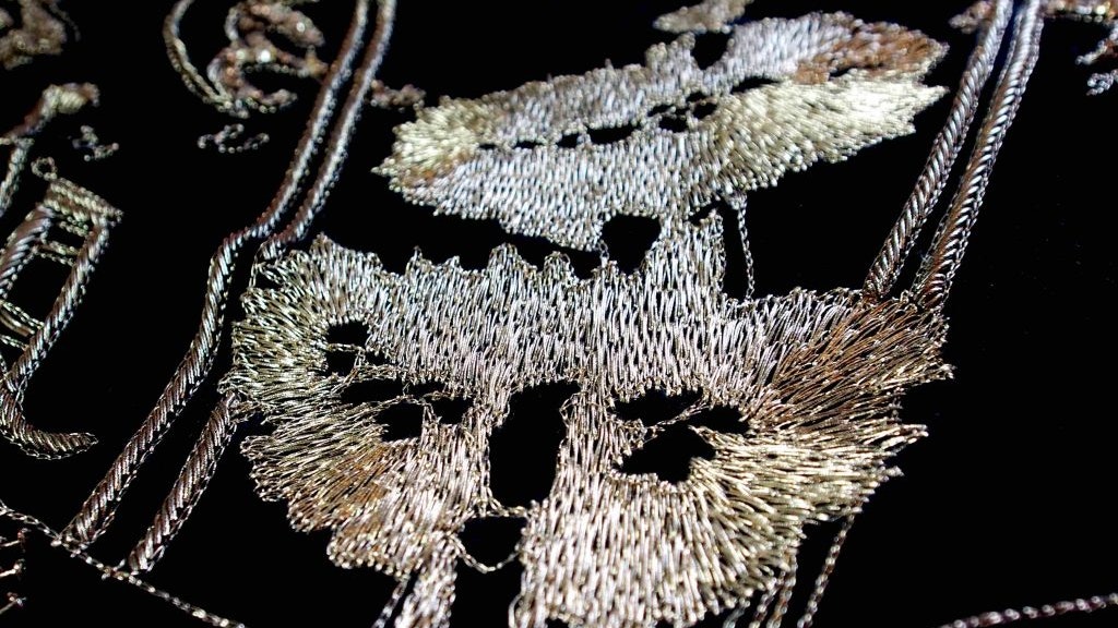 Gold and black embroidered artwork as part of Nusra Latif Qureshi's exhibition Strategies of Intent.