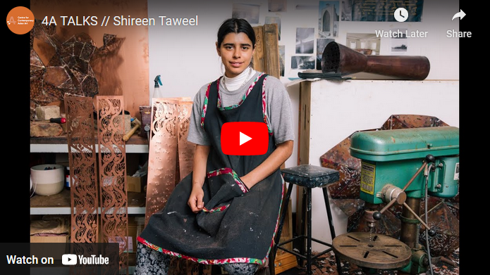 A YouTube screenshot showing artist Shireen Taweel seated in her studio.