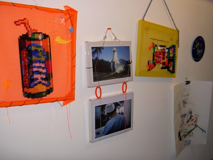 Phase 4: Katherine Huang, Milk, 2004, Pixel blocks and plastic tapestry on orange mesh, installation view