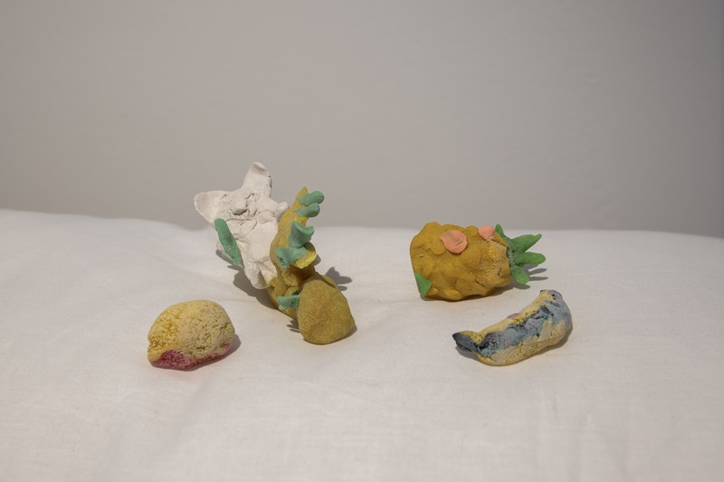 Shirley Hilyard (1929–2023) and Virginia Hilyard, Remembering Yellow, 2021/2023, modelling clay, pillows and plasticine, dimensions variable. Courtesy the artists.