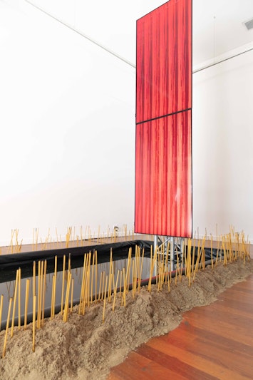 Rel Pham, Cache, 2023, incense, sand, talismans, trinkets, two-channel video, 4m 0s and water, dimensions variable. Commissioned by 4A Centre for Contemporary Asian Art. Supported by The City of Sydney’s Lunar New Year 2023, Festivals and Events Sponsorship Grant Program. Image: Anna Hay