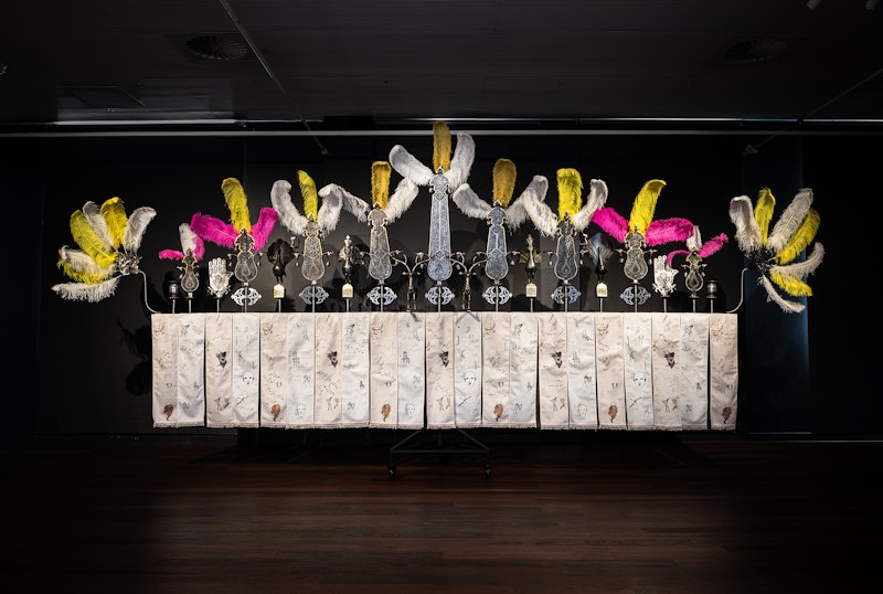 We, of Secrets Kept Hidden, 2023–24, gold leaf, iron, steel, prints on velvet, 650 x 280 x 84cm. Courtesy the artist. Commissioned by Arts House, Melbourne. Supported by the Australian Government through Creative Australia, its arts funding and advisory body.