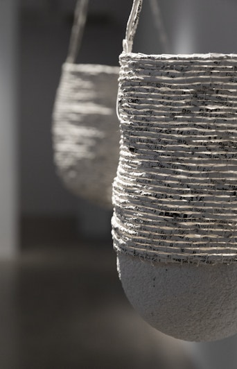 Jenna Mayilema Lee, dis/bound re/bound (detail), 2021, Pages of ‘Aboriginal words and place names’, bookbinding thread, varnish. Courtesy of the artist and MARS Gallery, Naarm/Melbourne.