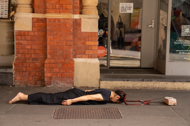 Weizen Ho, material : brick ~ material : body (performance view), 2026. Photograph by Christina Mishell.