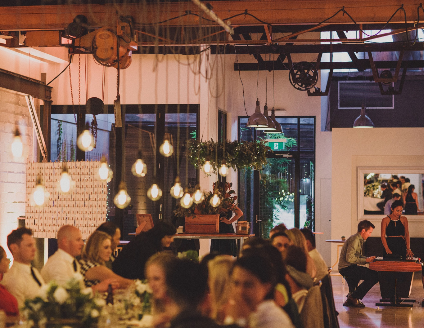 Wedding guests sitting at a dinner table.