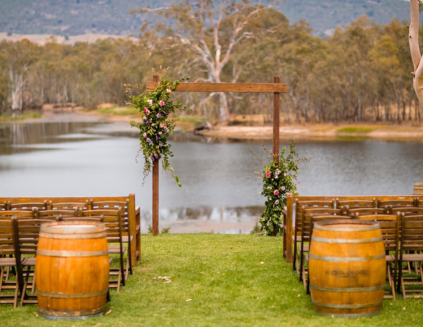 Wedding asile and archway overlooking water.