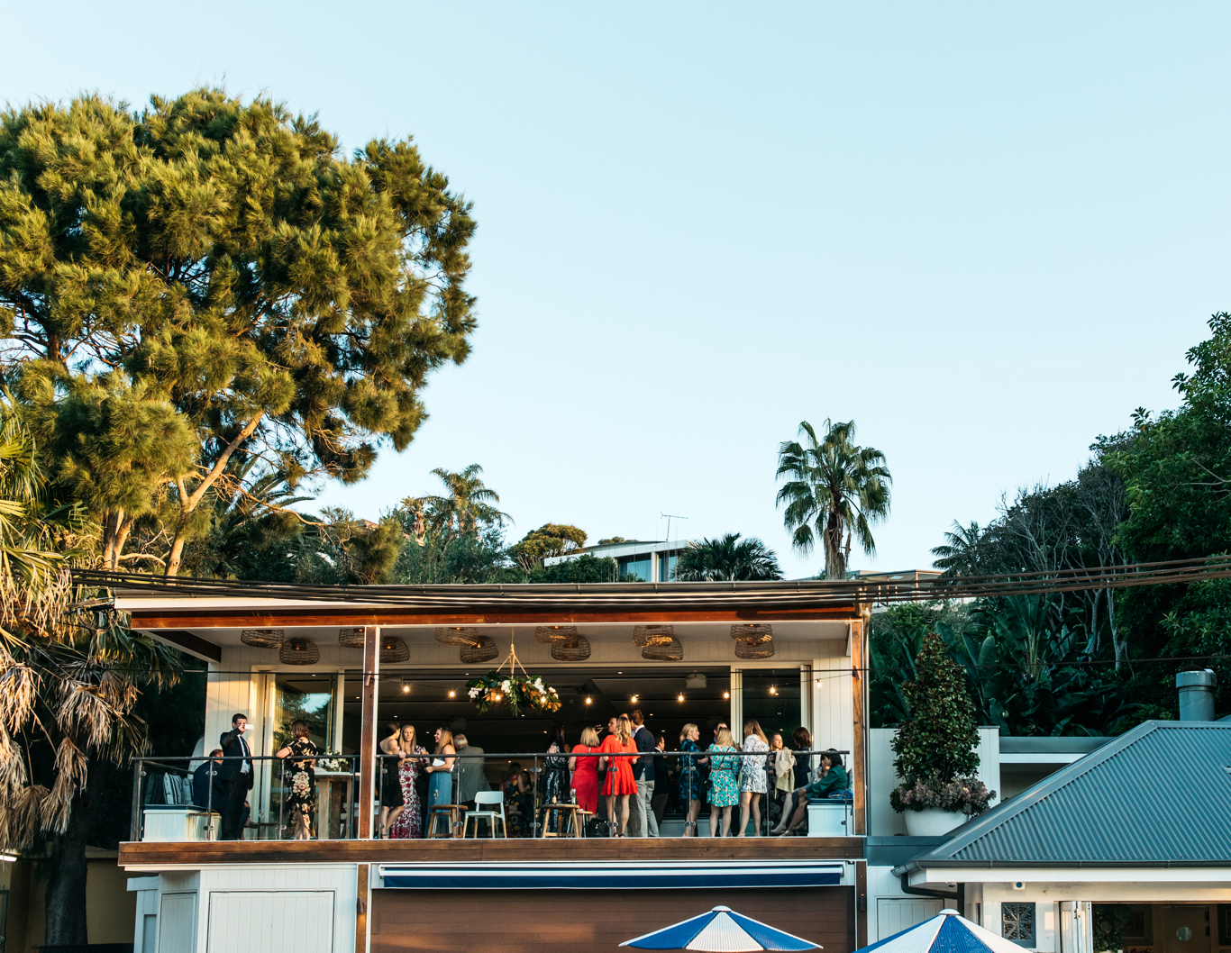 Wedding guests mingle on the Boathouse balcony.