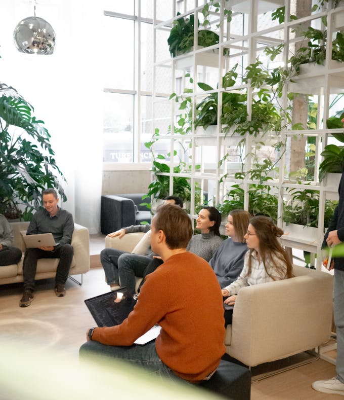 People sitting in a group watching in the same direction during a presentation